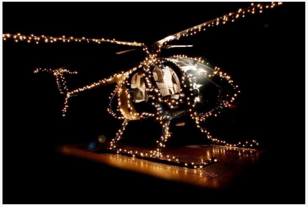 Helicopter decorated with festive lights.